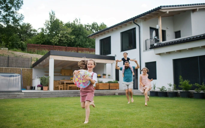 Young Austin family enjoying their home's backyard.